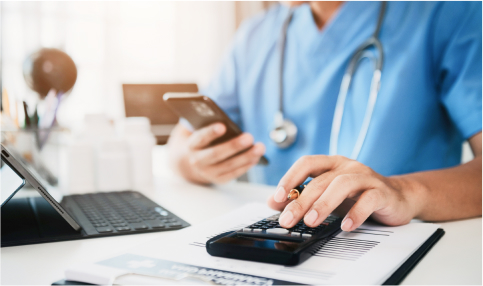 doctor using calculator and smartphone