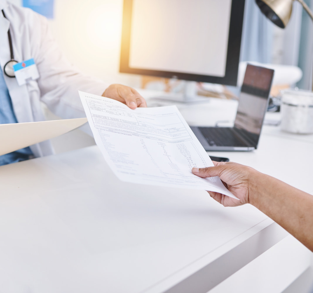 patient handing over medical history to doctor