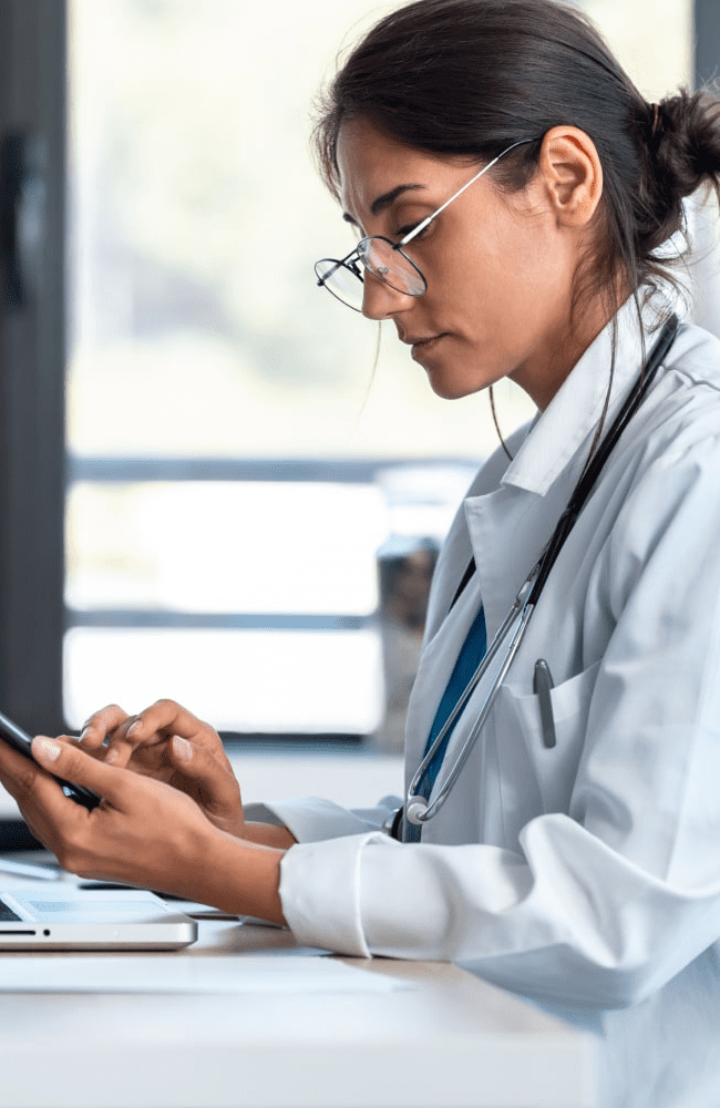 female doctor using her smartphone